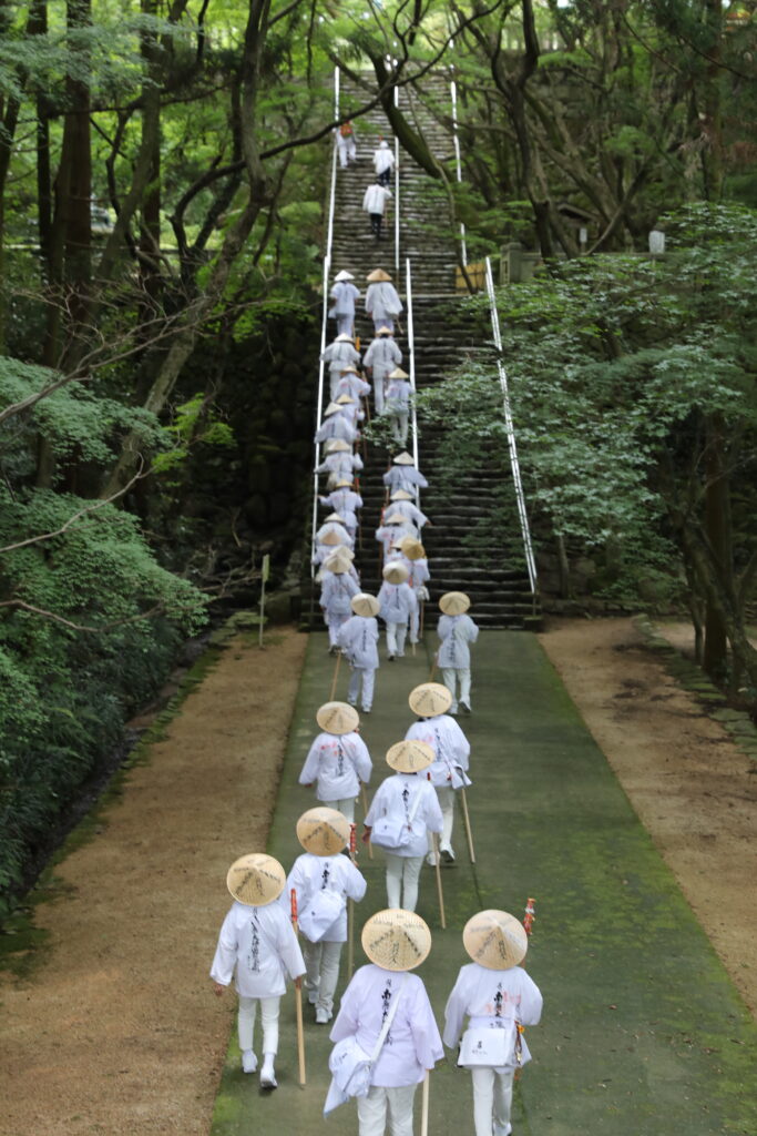 A busload of pilgrims climbs the stairs of Negoro-ji, Temple 82 of the Shikoku Pilgrimage.