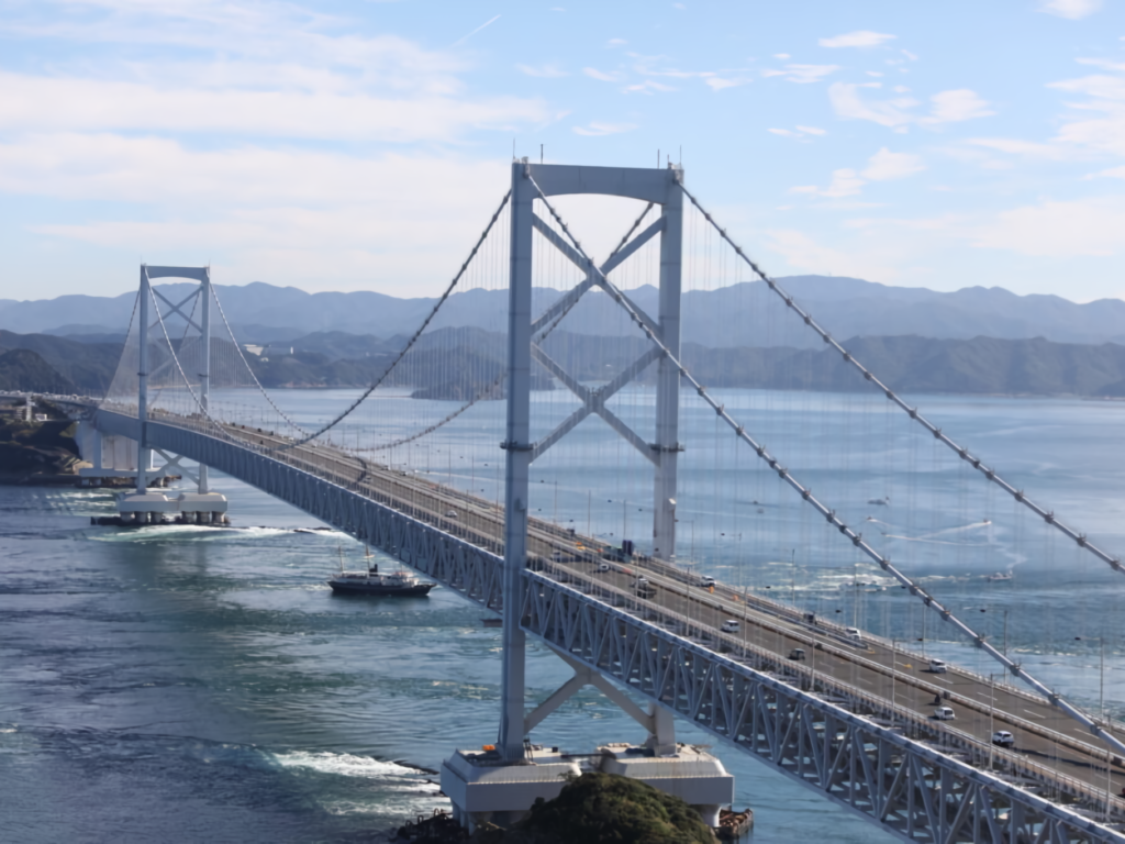 The Ohnaruto Bridge spanning across the sea with visible whirlpools.