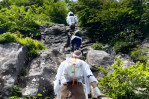 A Shugendo practitioner prepares to climb the third and final set of chains on Mt. Ishizuchi