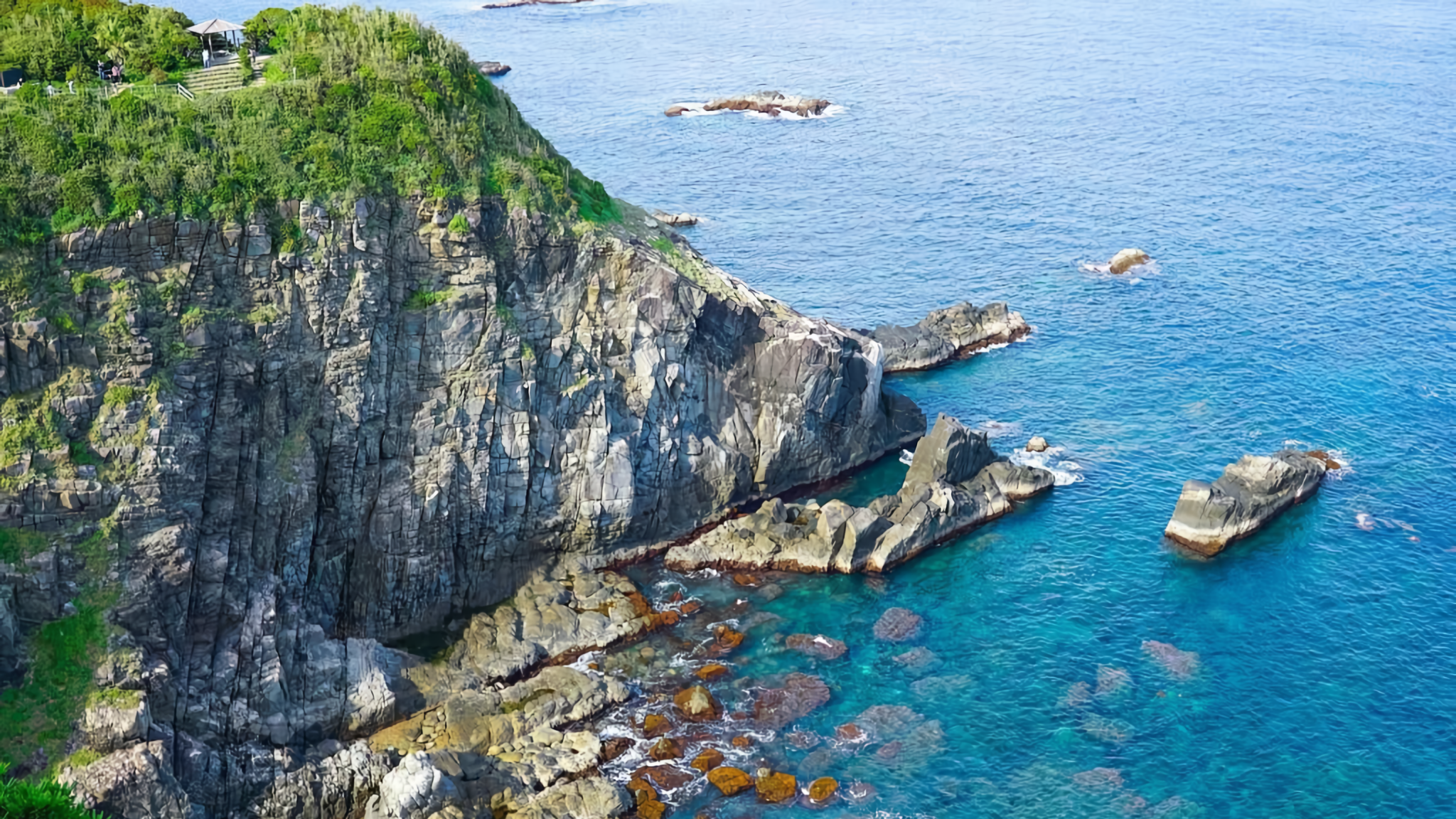 The scenic rocky cliff of Cape Ashizuri overlooking blue sea.