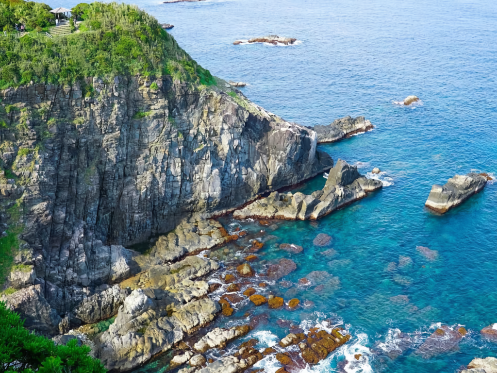 The scenic rocky cliff of Cape Ashizuri overlooking blue sea.