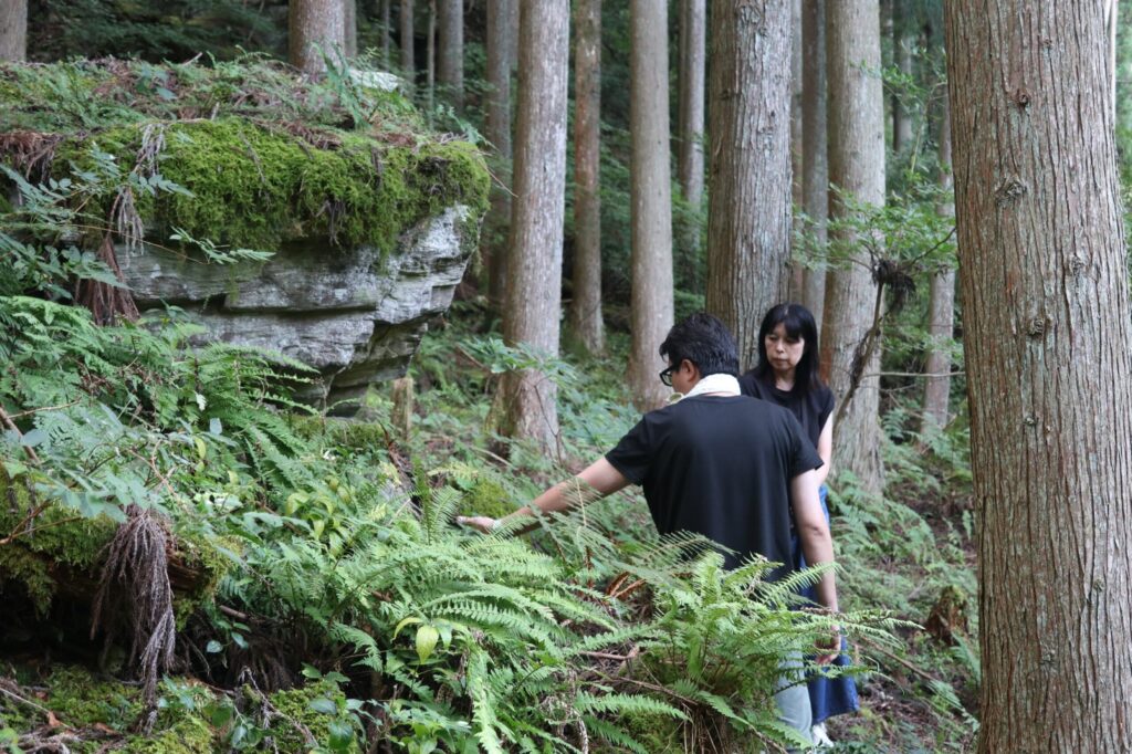 Ishikawa-san guides guides visitors to his family’s Yama no Kami. Farming practices like this reflect the deepest roots of Japanese spirituality.