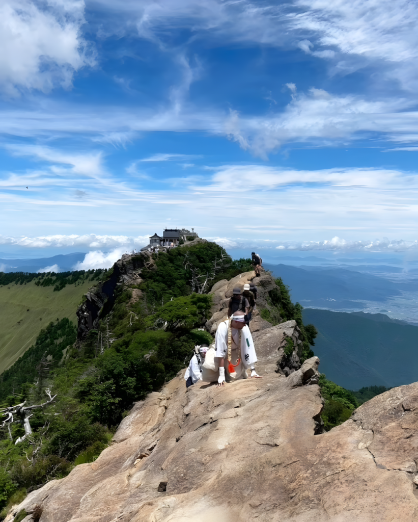Mt. Ishizuchi as seen from its peak. Ishizuchi Shrine is in the middle, and the caldera wall is visible at left. 