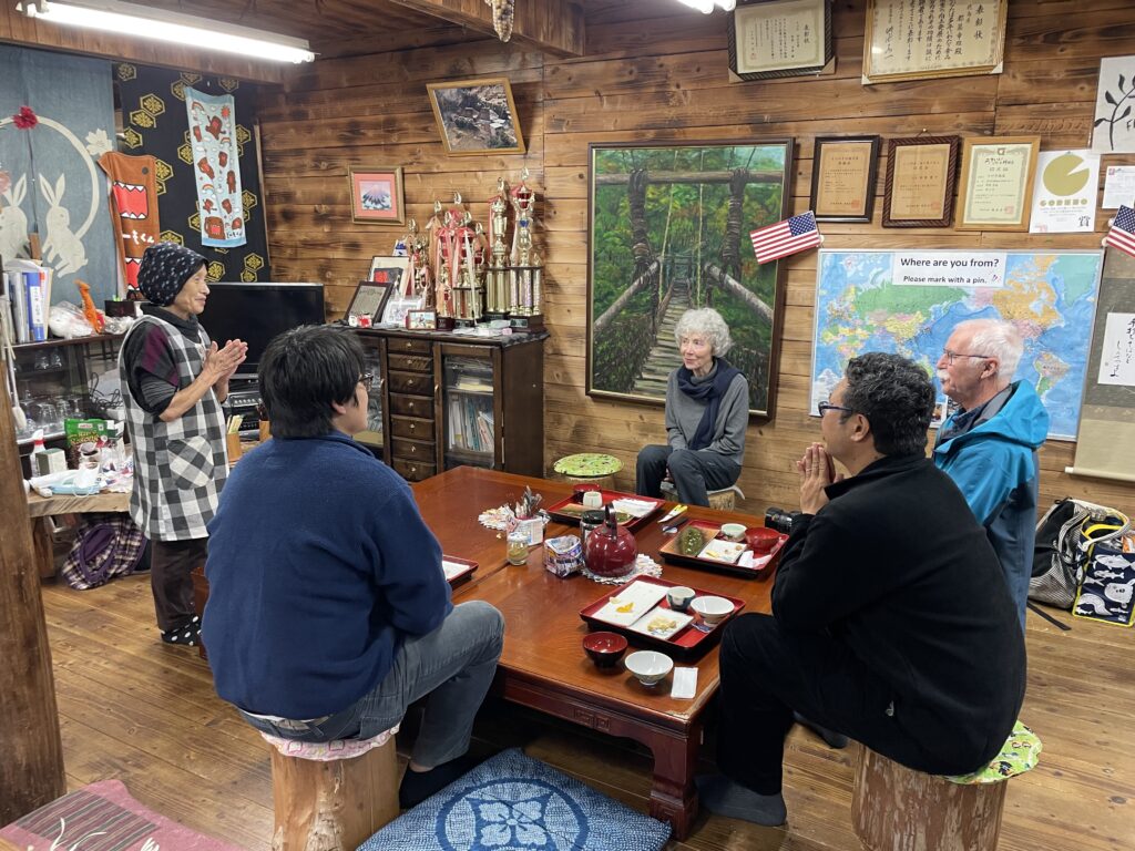 Ms. Reiko Tsuzuki regales visitors to her soba shop. 