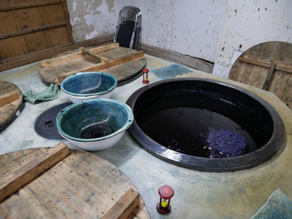 A vat of fermenting indigo at the Ai no Yakata Indigo museum. The indigo dyeing space is a repurposed warehouse dating to the 1800s.