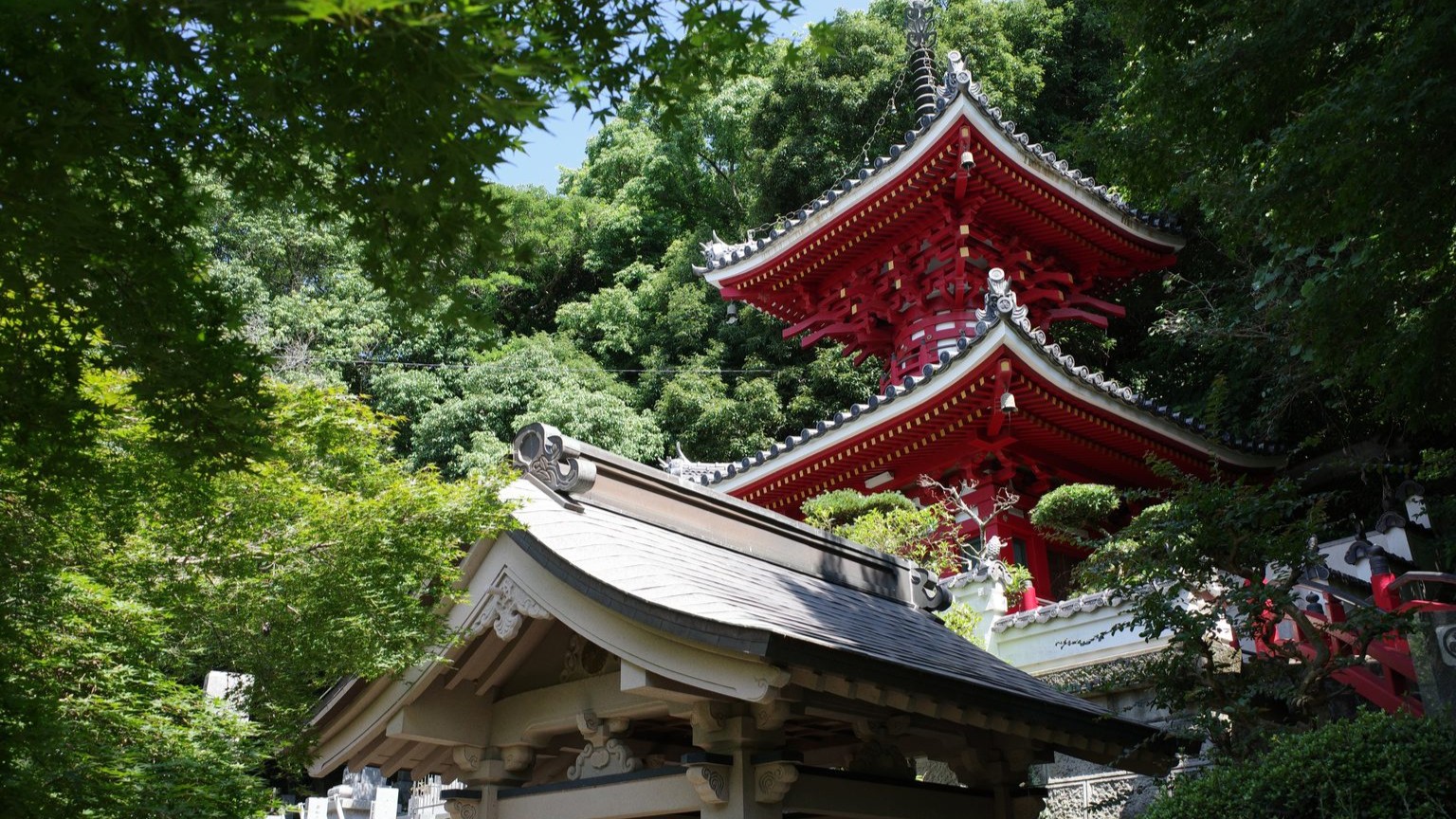 The two-storey pagoda of Konsen-ji, Pilgrimage Temple 2, surrounded in the rich greenery of the Tokushima countryside. 